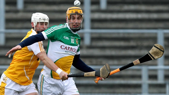 Antrim's Aaron Graffin with Offaly's Colin Egan