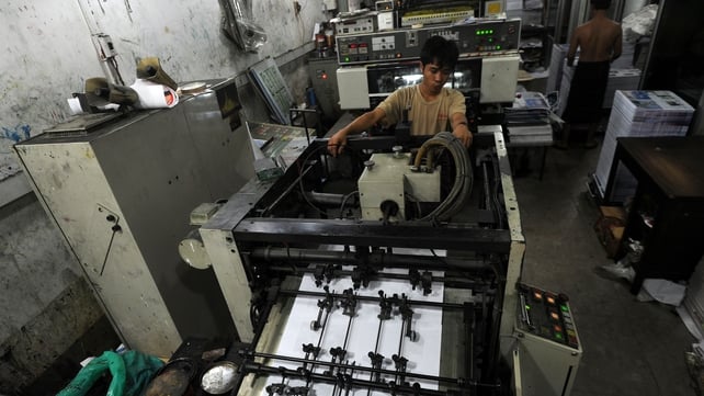 An employee monitoring the printing of newspapers at a printing house in Yangon last month An employee monitoring the printing of newspapers at a printing house in Yangon last month