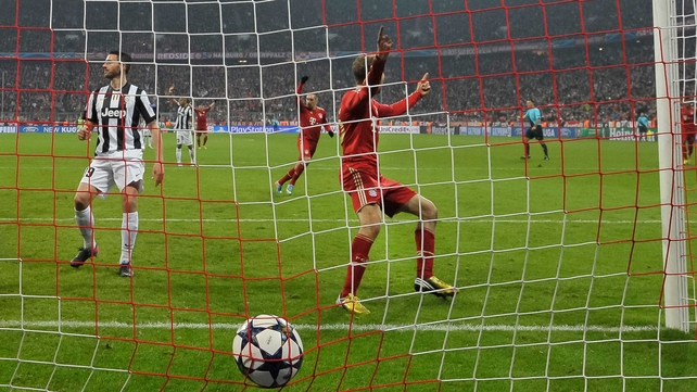 Bayern Munich's striker Thomas Mueller scores the second goal