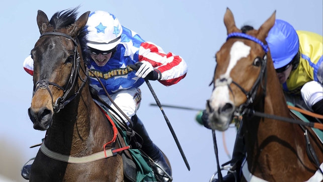 Bryan Cooper drives Special Tiara (left) past Overturn in the closing stages