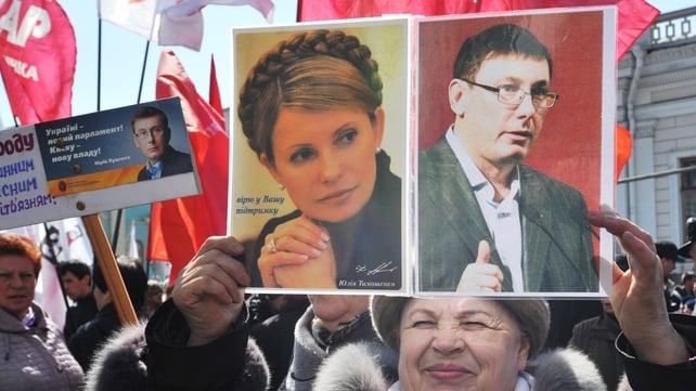 A woman calling for the release of Yulia Tymoshenko and Yuri Lutsenko at a protest last week A woman calling for the release of Yulia Tymoshenko and Yuri Lutsenko at a protest last week