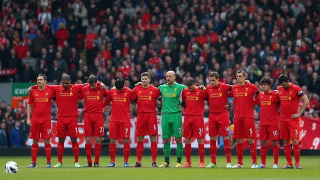The Liverpool players acknowledge a minute's silence for the victims of the Hillsborough disaster