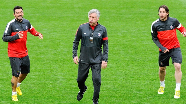 Carlo Ancelotti warms up with Ezequiel Lavezzi and Maxwell in the Nou Camp