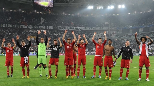 Bayern Munich salute their travelling fans after the victory in Turin