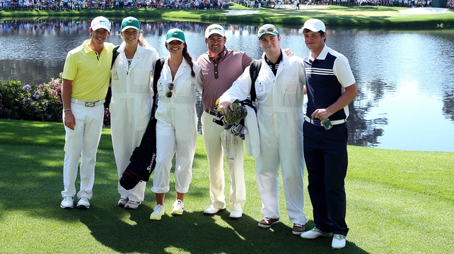 Rory McIlroy, Graeme McDowell and Alan Dunbar with their respective caddies at the par three event