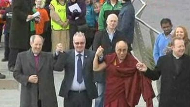 The Dalai Lama crossed the peace bridge linking the mainly Catholic west side of the river with the mainly Protestant east side The Dalai Lama crossed the peace bridge linking the mainly Catholic west side of the river with the mainly Protestant east side
