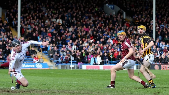 Kilkenny's Colin Fennelly under pressure from Paul Killeen of Galway, scores a goal past goalkeeper Colm Callanan