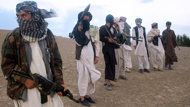 This file photo shows fighters with Afghanistan's Taliban militia standing on a hillside at Maydan Shahr in Wardak province, west of Kabul This file photo shows fighters with Afghanistan's Taliban militia standing on a hillside at Maydan Shahr in Wardak province, west of Kabul