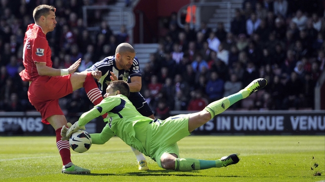 Ben Foster dives low to prevent Southampton's Morgan Schneiderlin