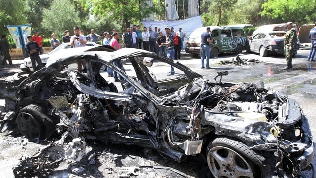 People gather at the scene of the explosion in the Mezze district of Damascus People gather at the scene of the explosion in the Mezze district of Damascus