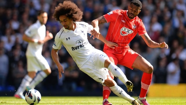 Benoit Assou-Ekotto of Tottenham Hotspur is marshalled by Southampton's Guilherme do Prado