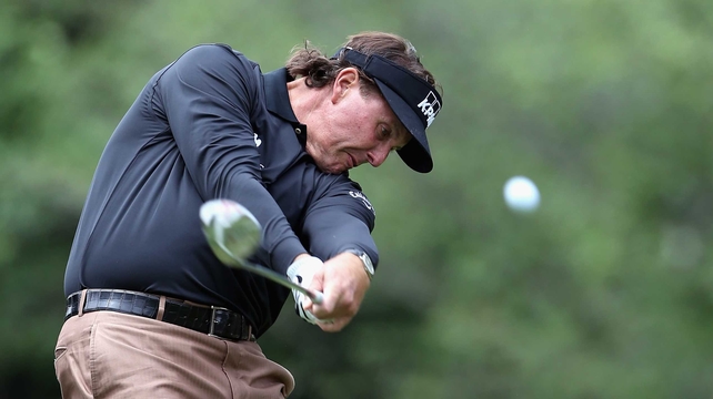 Phil Mickelson shot a one over 73 but holds a share of the lead going into the final day