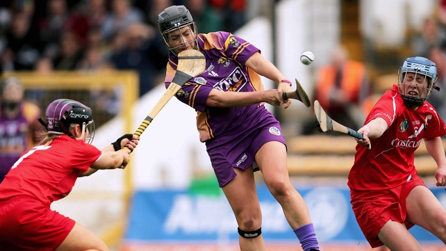 Cork's Anna Geary and Rena Buckley put pressure on Ursula Jacob of Wexford