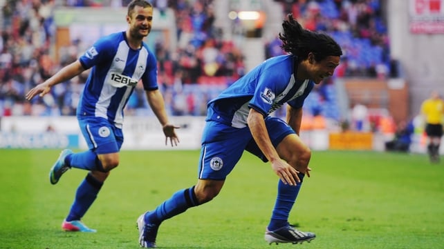 Roger Espinoza celebrates Wigan's opening goal against Swansea