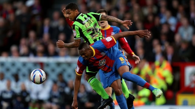 Kagisho Dikgacoi of Crystal Palace is challenged by Liam Bridcutt of Birghton