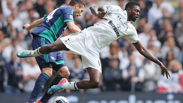 Emmanuel Adebayor takes a tumble