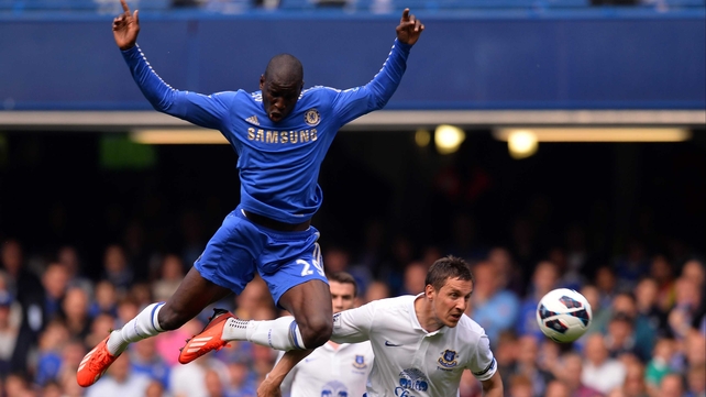 Demba Ba rises above Philip Jagielka of Everton