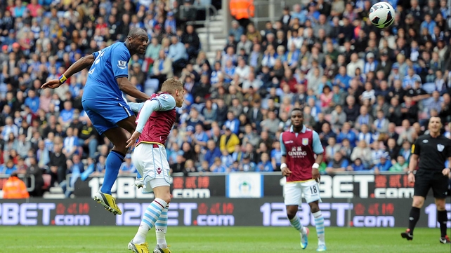 Emmerson Boyce of Wigan Athletic heads his side's first goal