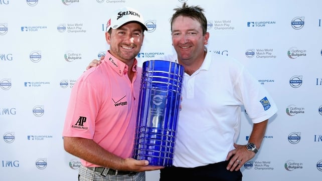 Graeme McDowell poses with his caddie Ken Comboy after winning the Volvo World Match Play Championship