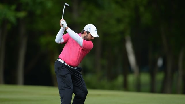 Francesco Molinari holds a one-shot lead in Surrey