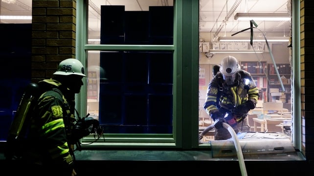 Firemen extinguish a burning school room in the Stockholm suburb of Tensta after youths rioted in few different suburbs around Stockholm and Sweden Firemen extinguish a burning school room in the Stockholm suburb of Tensta after youths rioted in few different suburbs around Stockholm and Sweden