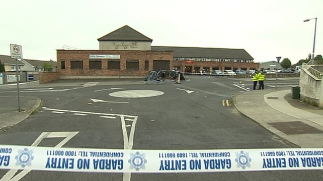 A motorbike with two men pulled up to St Dominic's Shopping Centre and a gunman fired five or six shots at the victim A motorbike with two men pulled up to St Dominic's Shopping Centre and a gunman fired five or six shots at the victim