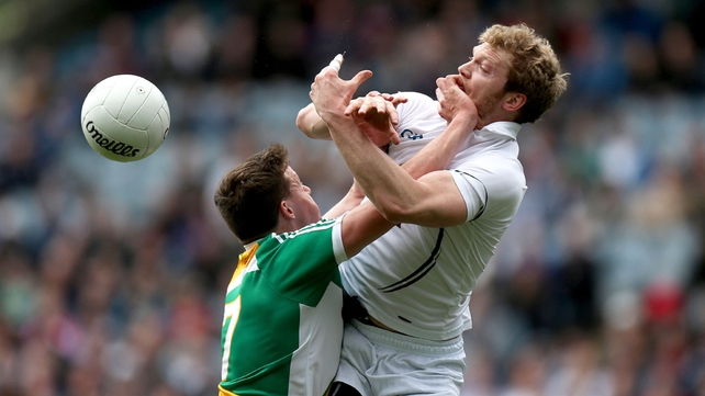 Michael Brazil of Offaly keeps a close watch on Tomas O'Connor of Kildare