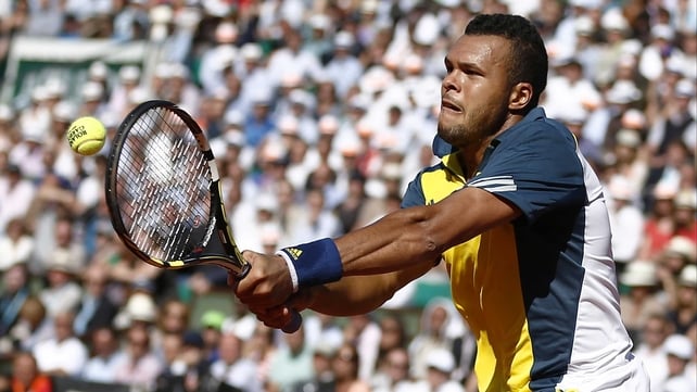 A focused Jo-Wilfried Tsonga unleashes a powerful backhand on Court Philippe Chatrier