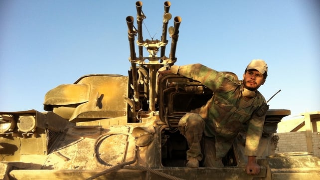 A Syrian soldier comes out of his tank as the army retakes Qusair A Syrian soldier comes out of his tank as the army retakes Qusair