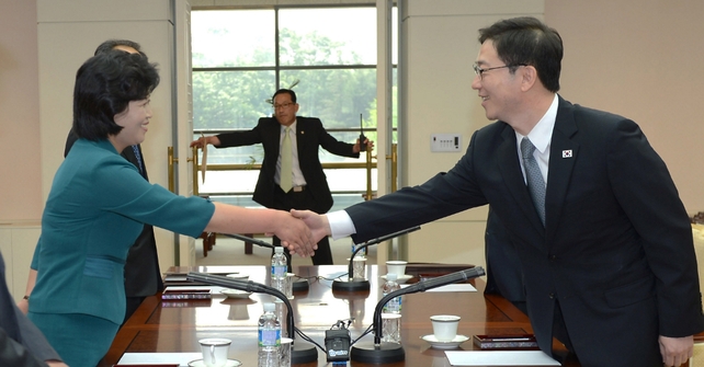 South Korea's senior Unification Ministry official and head of working-level delegation Chun Hae-Sung (R) shakes hands with his North Korean counterpart Kim Song-Hye (L) South Korea's senior Unification Ministry official and head of working-level delegation Chun Hae-Sung (R) shakes hands with his North Korean counterpart Kim Song-Hye (L)