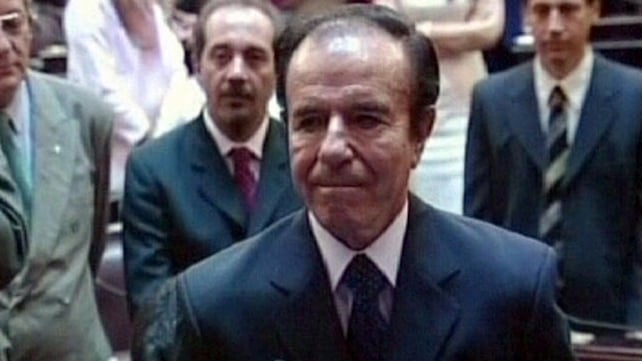 Carlos Menem, seen here in 2005 as he was sworn in as a senator, says he is "completely innocent" Carlos Menem, seen here in 2005 as he was sworn in as a senator, says he is "completely innocent"