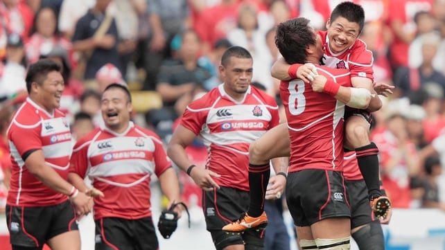 Japan celebrate their first ever win over Wales