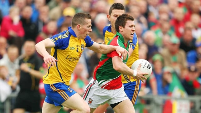 Mayo's Enda Varley is challenged by Seanie McDermott