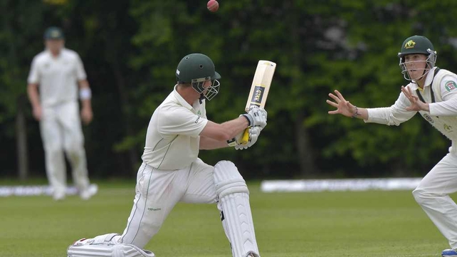 Andrew White (23) hits a tempting one to Australia's Nic Maddinson in Stormont