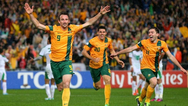 Josh Kennedy celebrates in front of jubilant Australian supporters