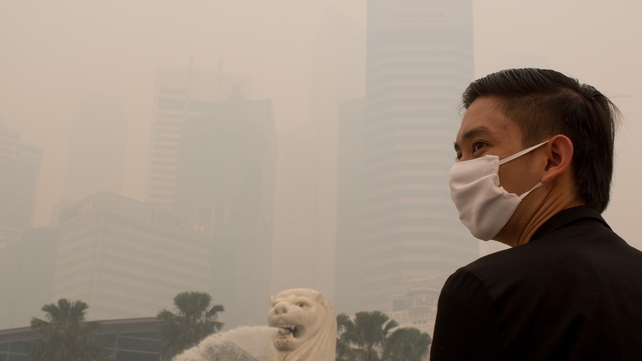 Free face masks were being distributed and people were advised to stay indoors in Singapore Free face masks were being distributed and people were advised to stay indoors in Singapore