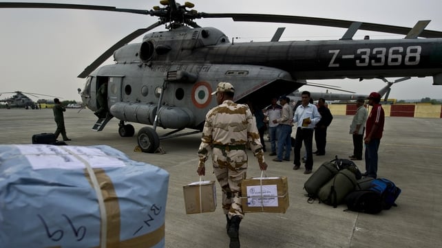 Indian military personnel load relief supplies for flood-hit areas in the state capital of Uttarakhand Indian military personnel load relief supplies for flood-hit areas in the state capital of Uttarakhand