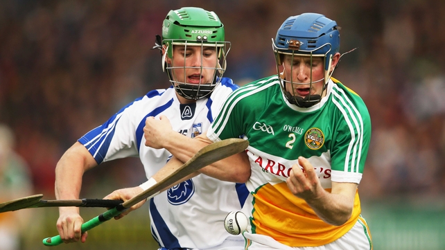 Chris McDonald and Brian O'Sullivan fight for possession