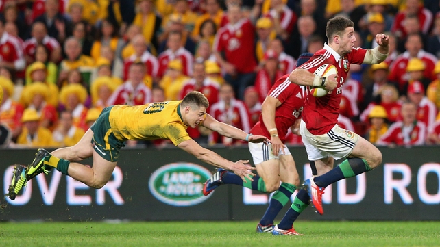 Alex Cuthbert of the Lions makes a break past James O'Connor of the Wallabies