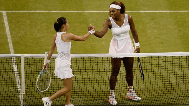 Serena Williams shakes hands with Kimiko Date-Krumm after their match