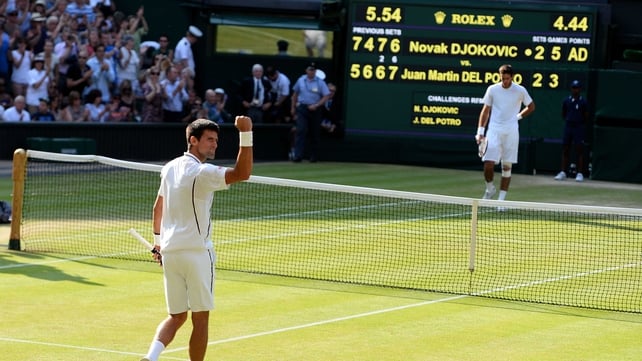 Novak Djokovic raises his fist in victory after firing a sublime winner to take the match