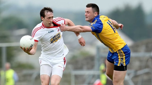 Roscommon's Donie Shine gets to grips with Tyrone's Colm Cavanagh
