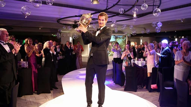 Andy Murray poses with the trophy during the Wimbledon Championships 2013 Winners Ball