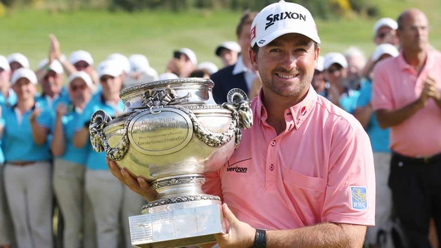 Graeme McDowell poses with his trophy after winning the French Open