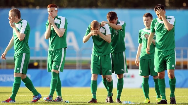 The Irish side show their disappointment after the penalty shootout