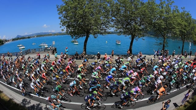 Riders make their way around Lake Annecy at the start of stage 20, a 125km road stage from Annecy to Annecy-Semnoz