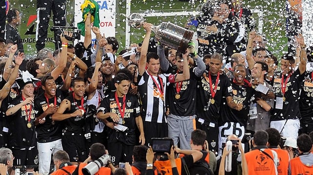 Atletico Mineiro captain Rever raises the Copa Libertadores trophy at the Mineirao stadium in Belo Horizonte