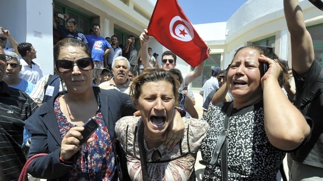 Tunisians react outside a hospital after the killing of Mohamed Brahmi Tunisians react outside a hospital after the killing of Mohamed Brahmi