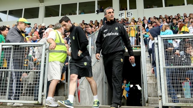 Mark McHugh and Jim McGuinness emerge from the tunnel at Páirc Seán Mac Diarmada