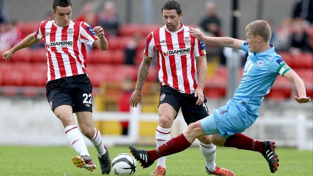 Drogheda's Derek Pendergast goes in on Derry's Michael Duffy